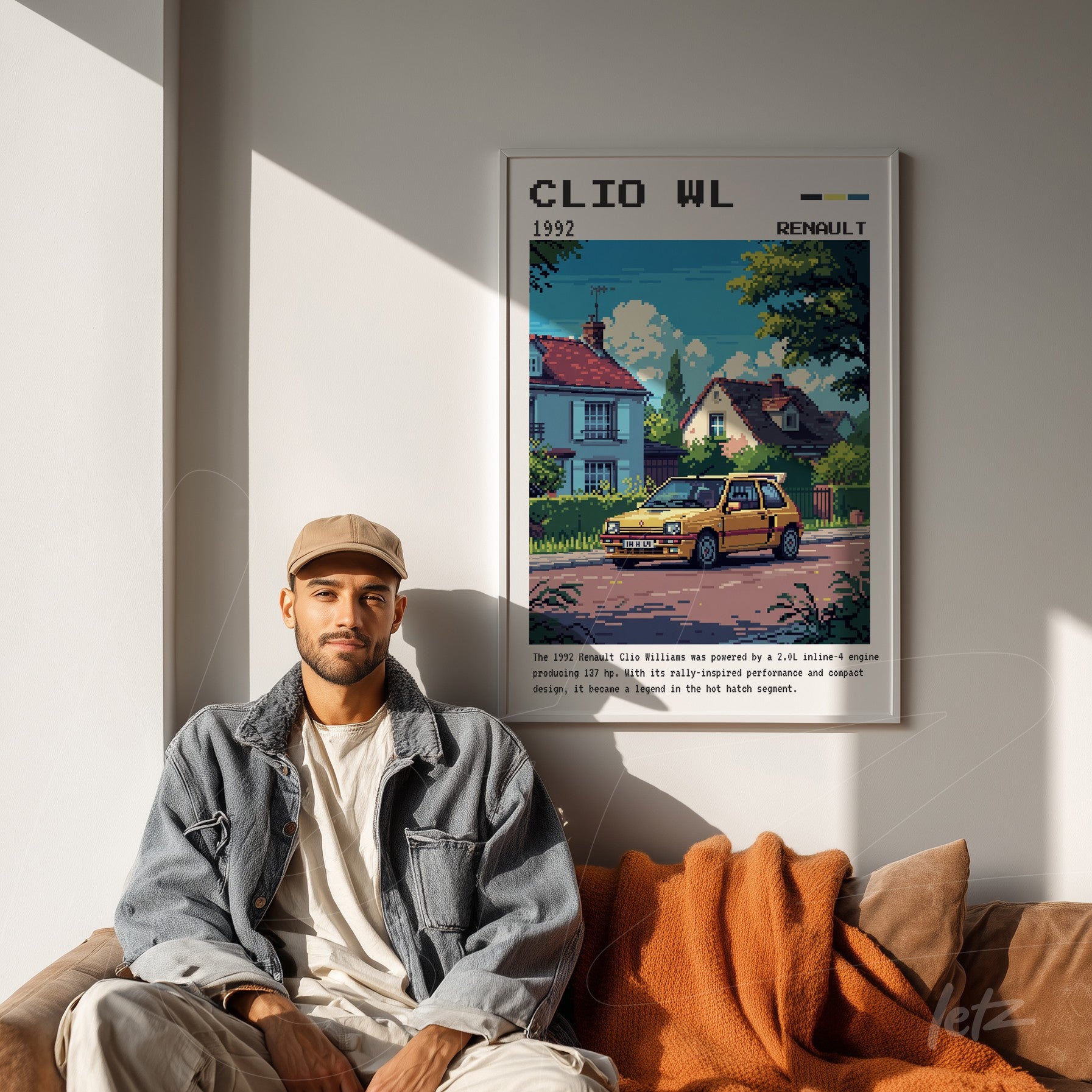 framed digital art of Renault Clio in a retro scene displayed on a light wall with a sofa in the background