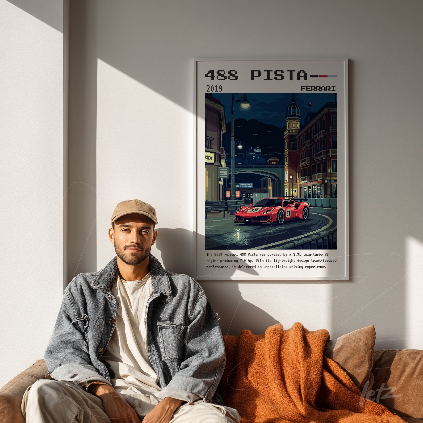 framed pixel art of a ferrari 488 pista in an urban setting displayed above a sofa with an orange blanket