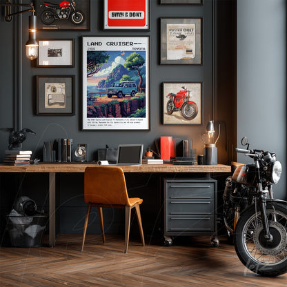 retro framed artwork of 1984 Toyota Land Cruiser in industrial style room with wooden desk and vintage motorcycle beside it