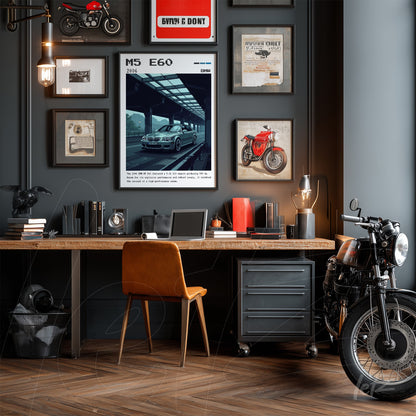 decorative wall art arrangement in a modern office with gray background featuring a BMW M5 print and framed motorcycle images, light wooden desk with brown leather chair and a classic motorcycle beside it