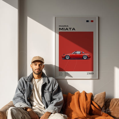 framed artwork featuring a 1989 Mazda Miata illustration against a red background