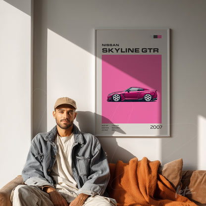 modern wall art featuring the nissan skyline gtr in a white frame displayed on a light wall next to a casually dressed young man