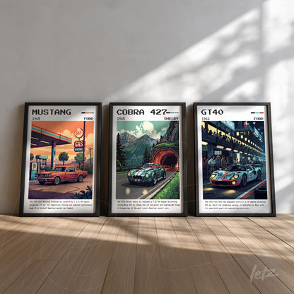 series of vintage style framed wall art depicting classic cars, featuring a 1965 mustang at a gas station, a 427 cobra on a mountain road, and a gt40 at a racetrack