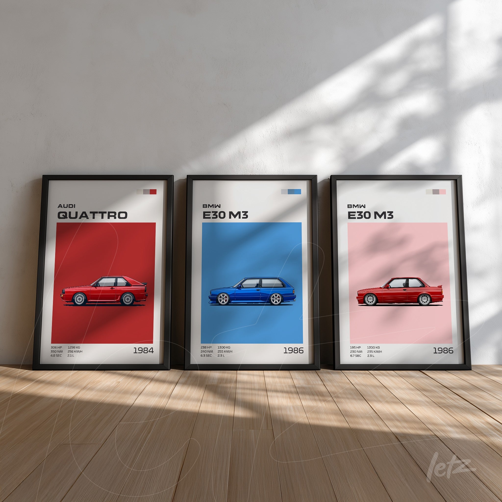 set of three framed car artworks featuring audi quattro in red, bmw e30 m3 in blue, and another bmw e30 m3 in pink, all against a light background