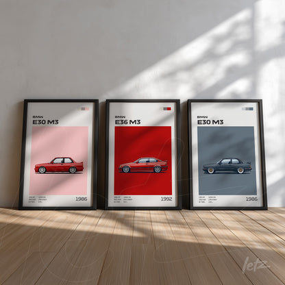 collection of framed artwork featuring illustrations of BMW M3 cars in red, blue, and gray against a light wall
