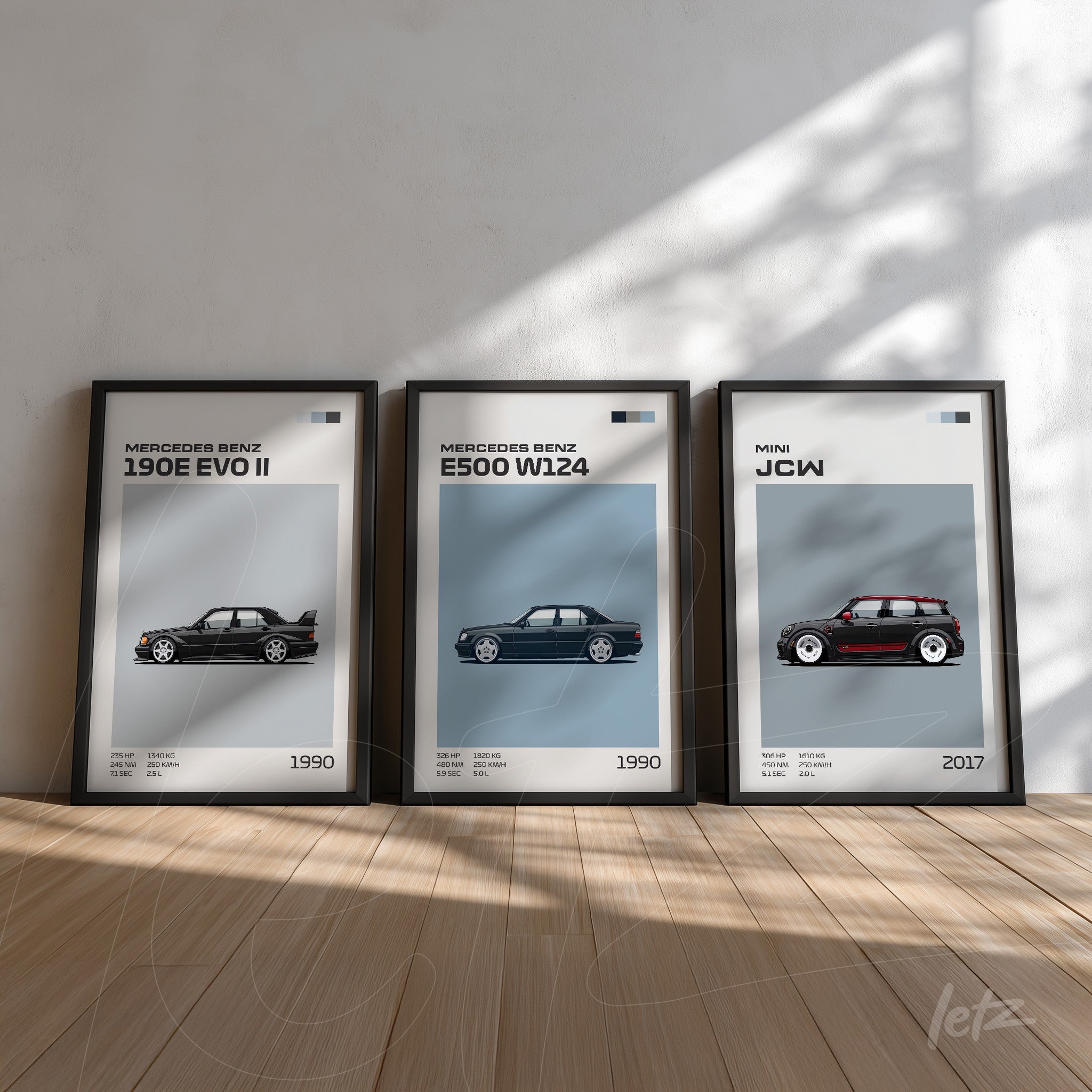 collection of framed artworks featuring classic cars Mercedes Benz in black frames, soft blue background