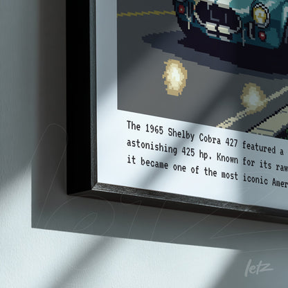 framed pixel art of the 1965 Shelby Cobra 427 with black frame, featuring descriptive text on light gray background