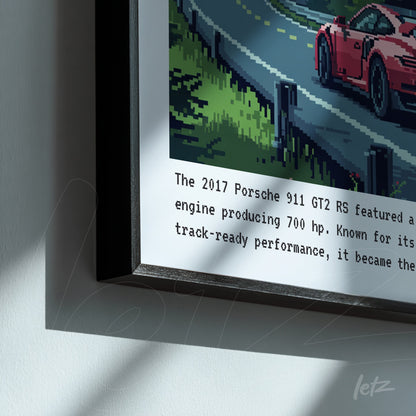 framed pixel art of a 2017 Porsche 911 GT2 RS on a winding road with a black frame and informational text below