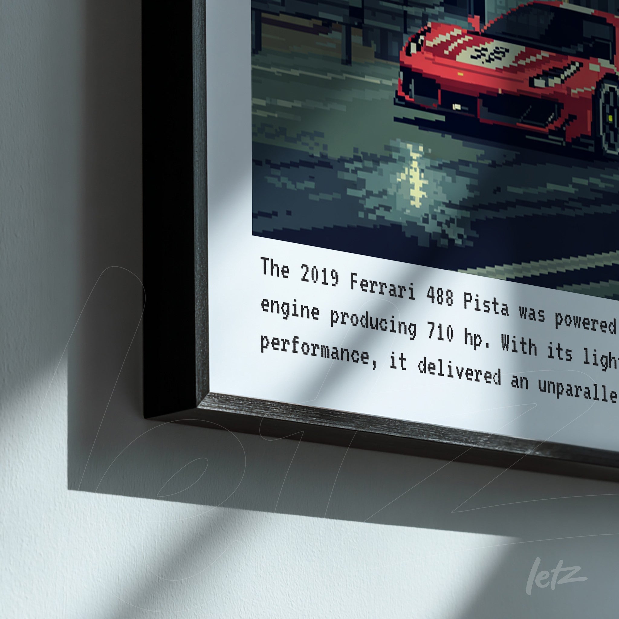 framed artwork in black showcasing pixel art of a red sports car, featuring racing elements and informative text about the Ferrari 488 Pista