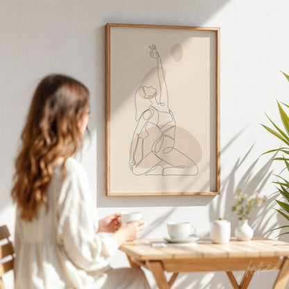 minimalist line art of a woman in a yoga pose, framed with light wood and displayed on a white wall
