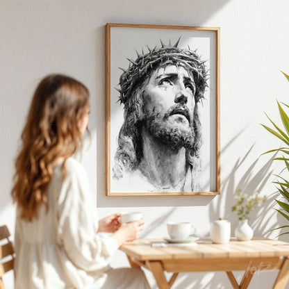 framed black and white portrait of Christ with crown of thorns in light wood frame