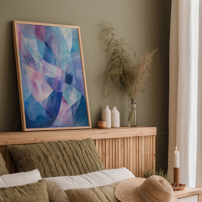 decorative wall art featuring abstract design in shades of blue and pink, framed in light wood displayed on green wall