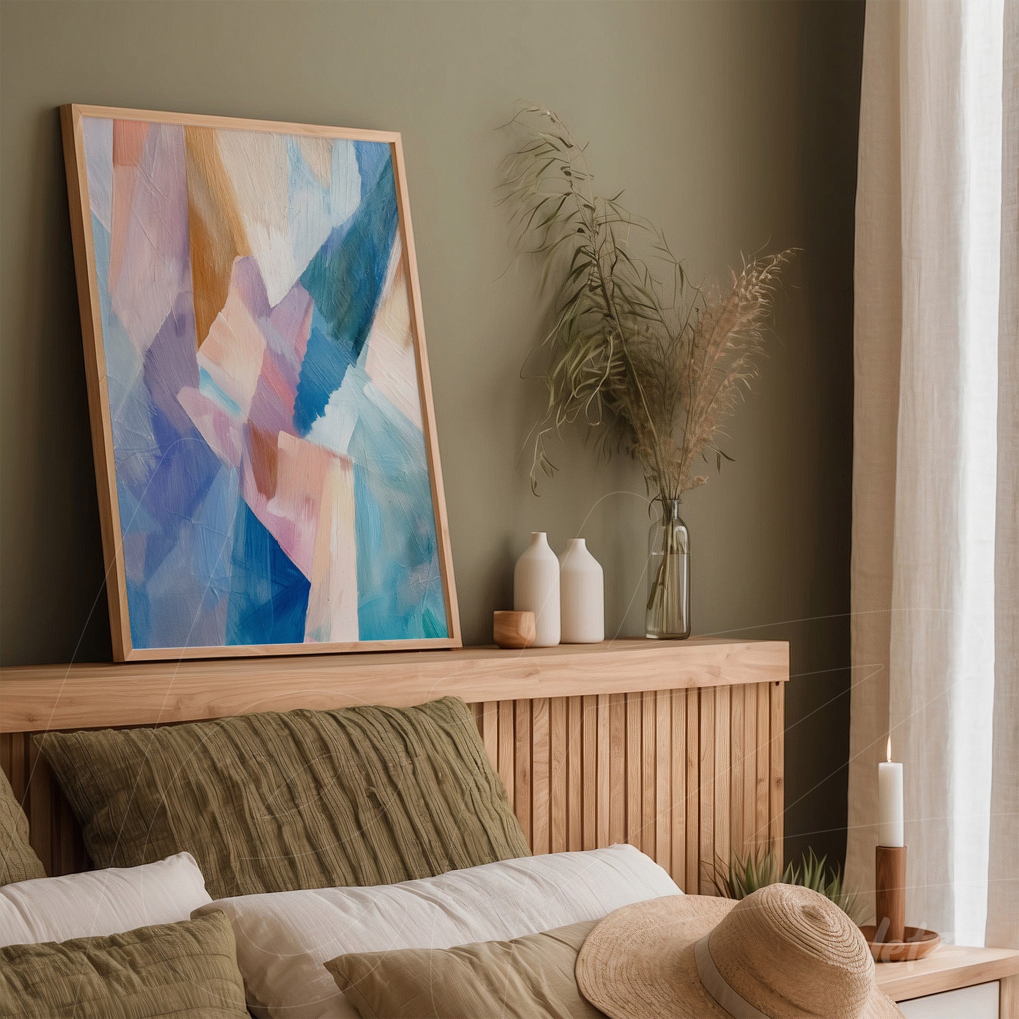 abstract artwork featuring geometric shapes in shades of blue and pink, framed in light wooden frame, displayed on a wooden shelf in a bedroom setting