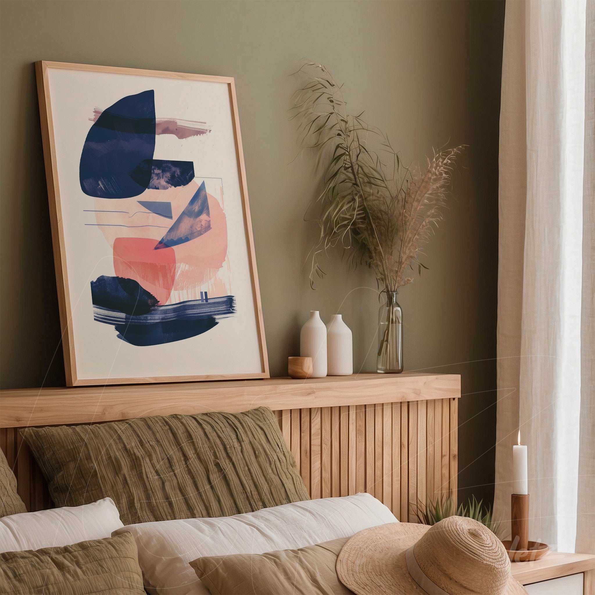 modern wall art featuring abstract shapes in blue and pink tones in a light frame on wooden headboard