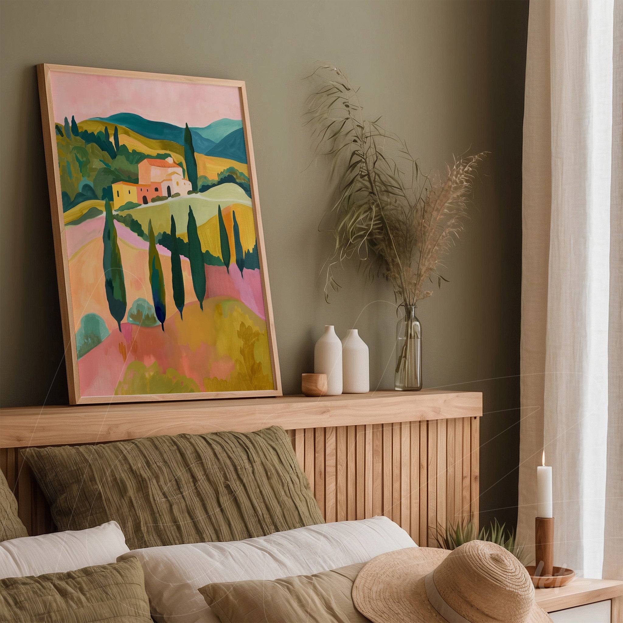 framed artwork featuring a pastoral landscape in pastel colors resting on a wooden headboard