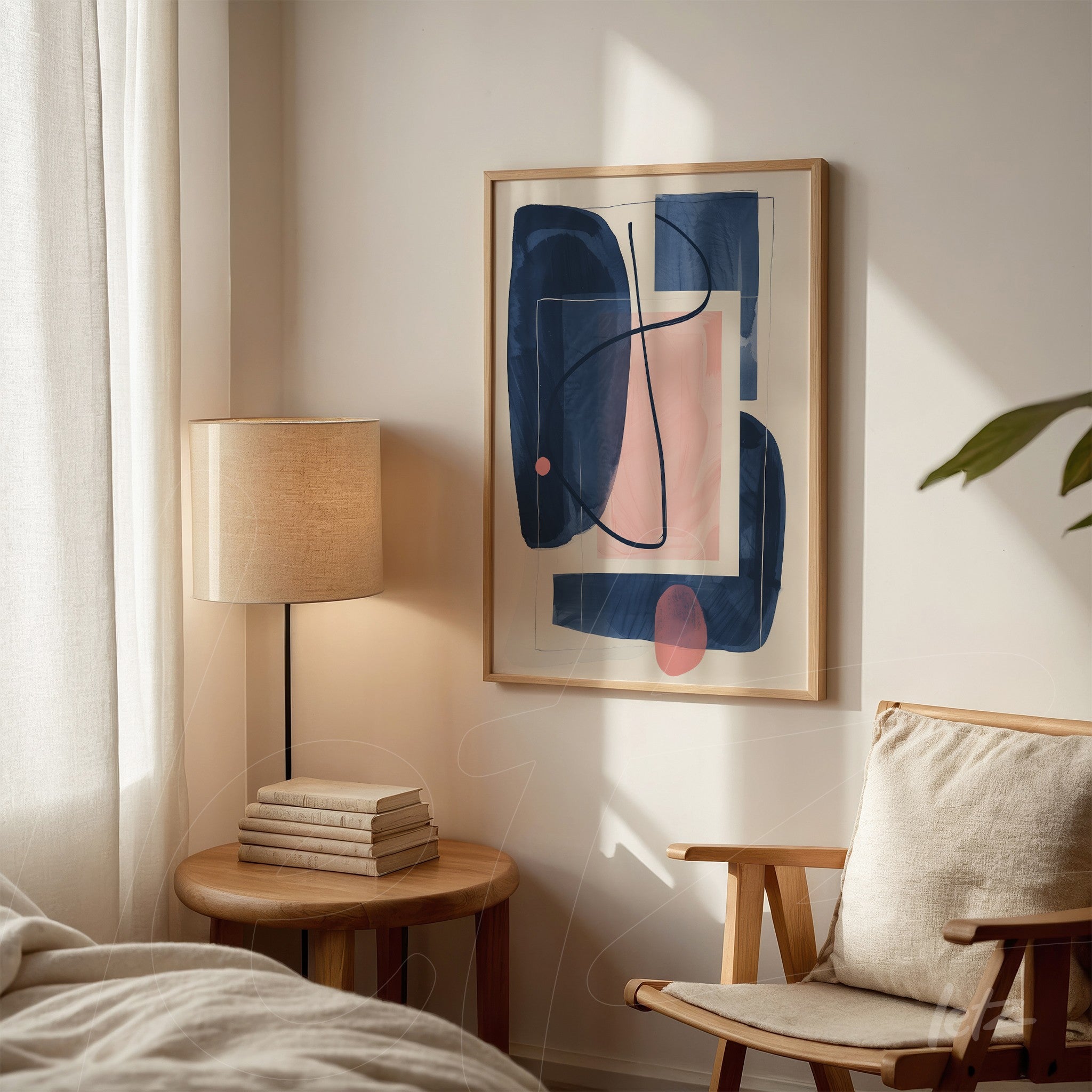 abstract wall art in blue and pink tones in light wood frame on a bright wall beside a lamp and nightstand