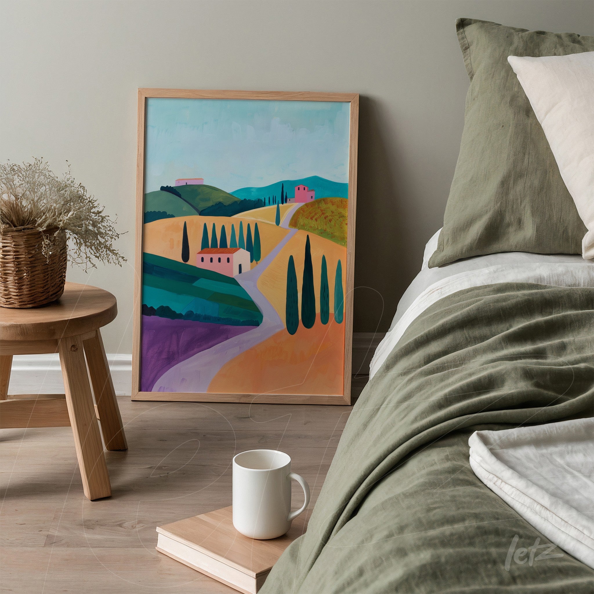 decorative art piece featuring a countryside landscape in light frame, displayed next to a bed with green bedding and light pillows