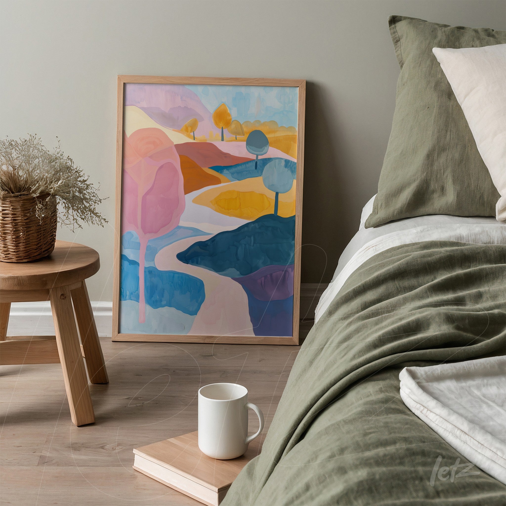 framed artwork featuring an abstract colorful landscape next to a bed adorned with green bedding