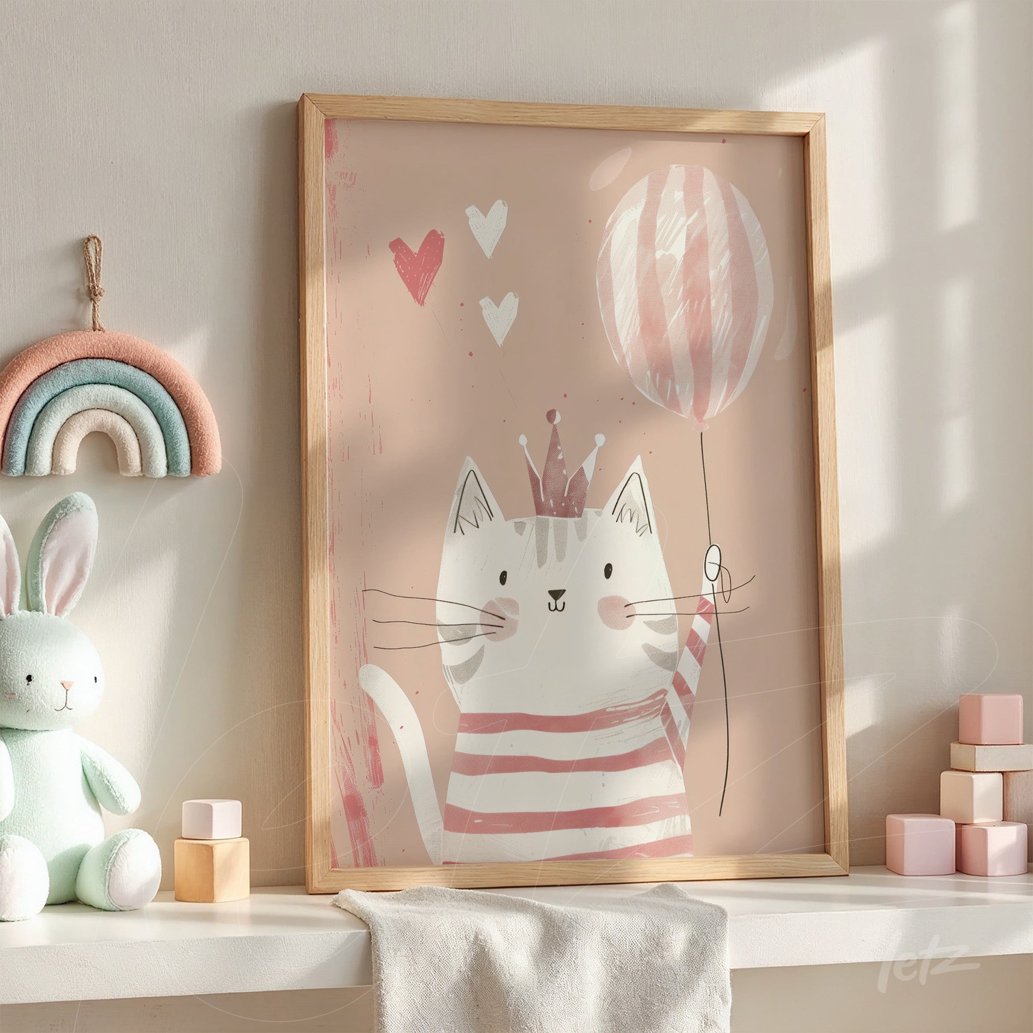 framed cute cat illustration holding a balloon in a light wooden frame displayed on a pastel-colored shelf