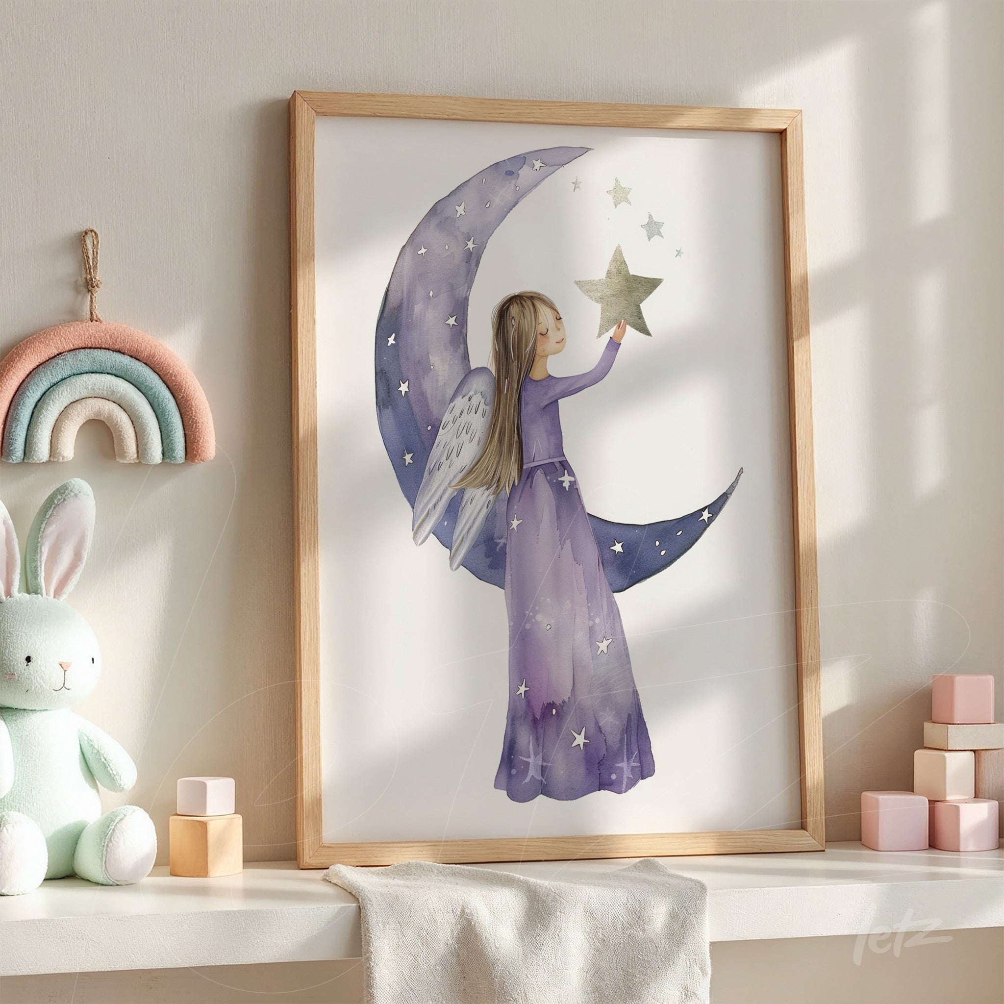 framed artwork of a girl with angel wings reaching for a star on crescent moon in light wooden frame