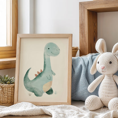 framed artwork of a smiling green dinosaur in a light wood frame displayed with a plush toy in a cozy setting