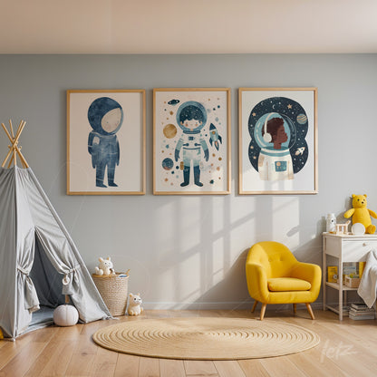 series of kids' wall art featuring astronauts in light wooden frames on blue wall with a play corner beside