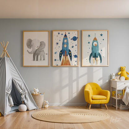 composition of children's wall art featuring a gray elephant and blue and orange rockets displayed on a soft blue wall with light wood frames