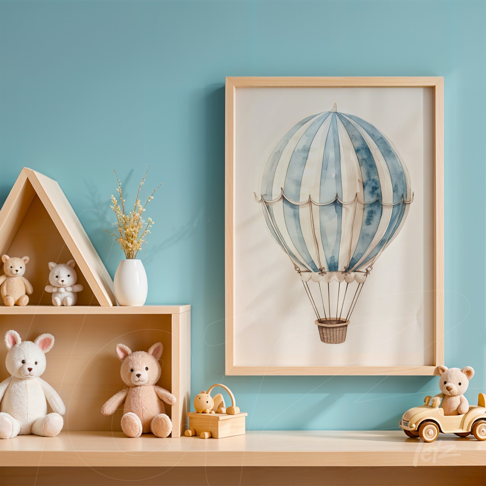 framed illustration of hot air balloon in light frame against blue wall, decorated with children's toys