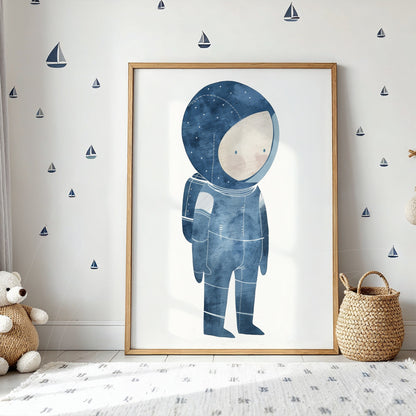 framed artwork featuring an astronaut illustration in shades of blue displayed against a wall with small boats decorations