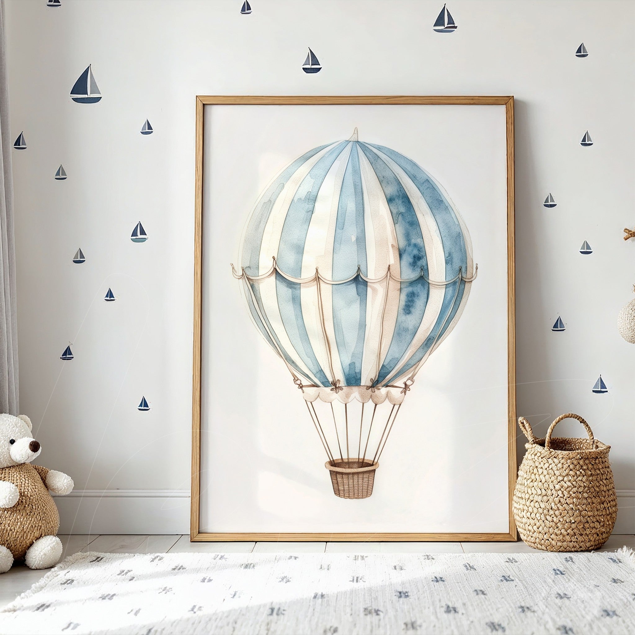 framed art print of a hot air balloon in shades of blue and cream with light wood frame displayed on a white wall featuring boat decals