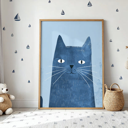 framed illustration of a blue cat with a light wooden frame in a decorated space featuring blue walls and sailboat stickers