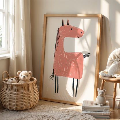 framed art featuring a playful pink horse illustration in a light wood frame, displayed on a shelf next to plush toys