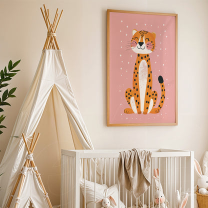 framed wall art featuring a cheerful leopard illustration on pink background, displayed in a nursery next to a white crib and a beige play tent