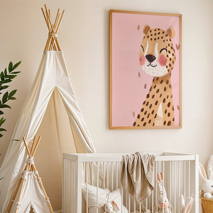 framed wall art featuring a smiling leopard illustration on pink background in a nursery setting