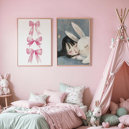 set of decorative wall art featuring pink bows and a girl with a bunny illustration in light wood frames displayed in a children's room with pink walls