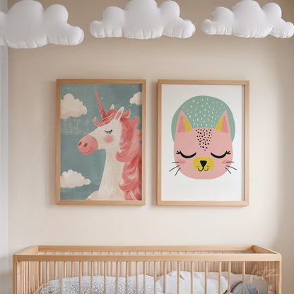 collection of child-friendly wall art featuring a pink unicorn illustration and a stylized cat face in light wood frames, displayed on a beige wall above a wooden crib
