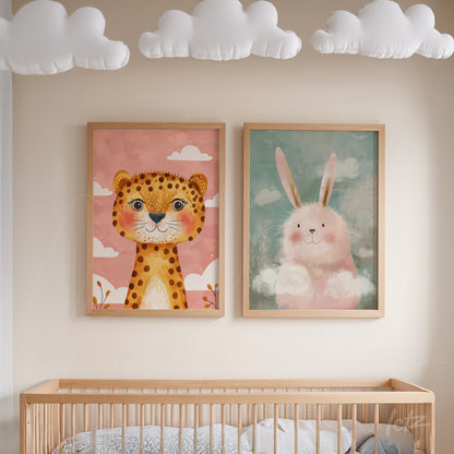 set of children's framed wall art featuring a stylized lion on pink background and a fluffy bunny on blue background, both in light wooden frames