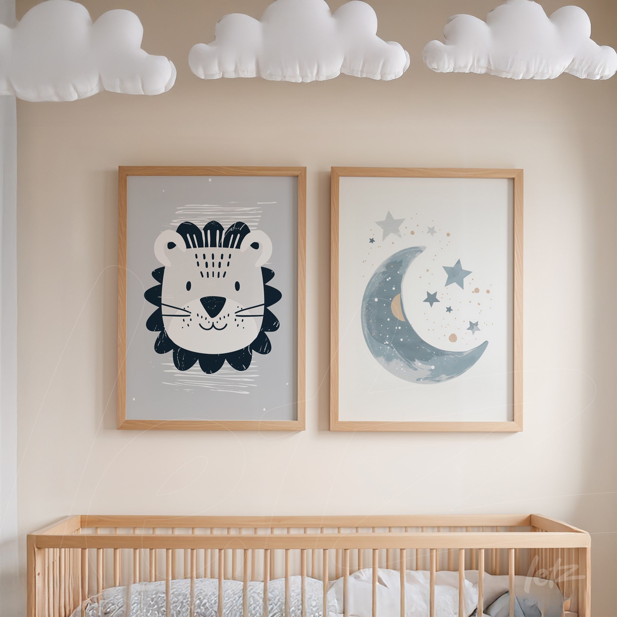 set of baby room wall art featuring a lion and a moon in light wooden frames displayed above a crib