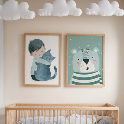 set of nursery wall art featuring a boy hugging a cat and a striped bear illustration in light frame