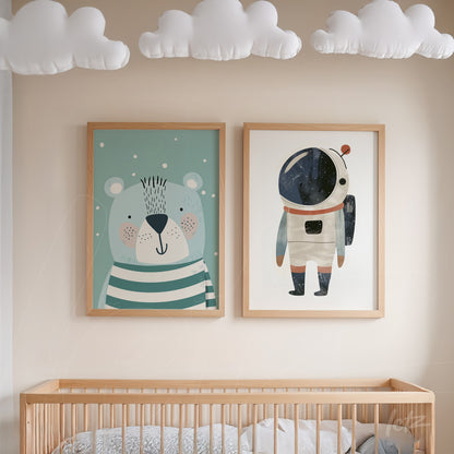 framed wall art composition featuring a striped bear illustration and a galaxy-themed astronaut, both in light wood frames on a neutral wall
