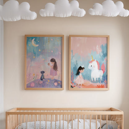 composition of two framed artworks in light wood, one featuring a girl sitting in a field under the moon and the other depicting a girl with a unicorn on a pink background