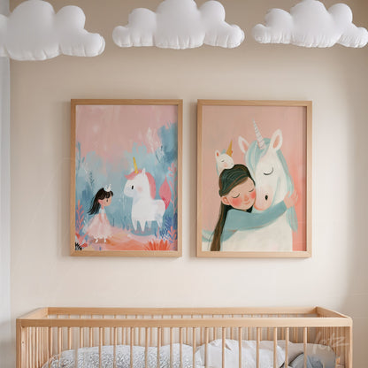 framed wall art featuring a girl hugging a unicorn next to another illustration of a child character and unicorn on a pink background