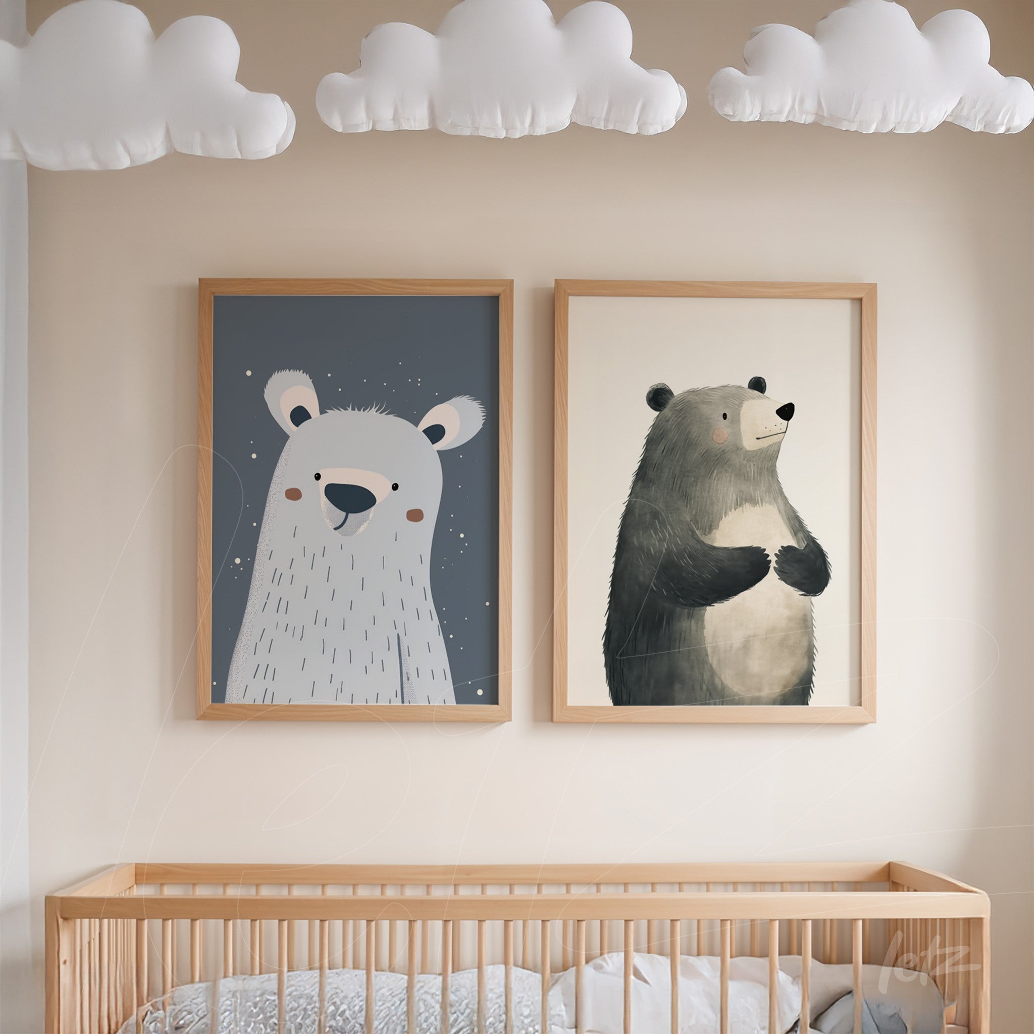 pair of children's bear prints displayed above a crib in a nursery, both with light wooden frames