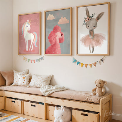 set of children's framed artworks featuring a unicorn, a poodle, and a bunny with light wooden frames displayed above a wooden bench with toys