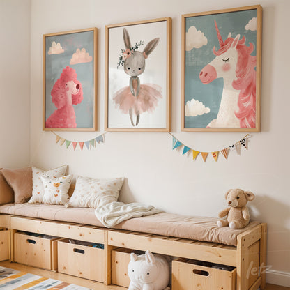 composition of three kids' wall art featuring a ballerina bunny, a pink sheep, and a unicorn displayed above a light wood sofa