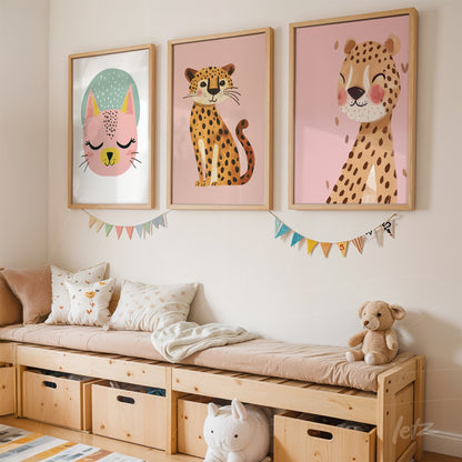 framed wall art composition featuring colorful illustrations of a cat, leopard, and bunny against a pink wall with light wood frames