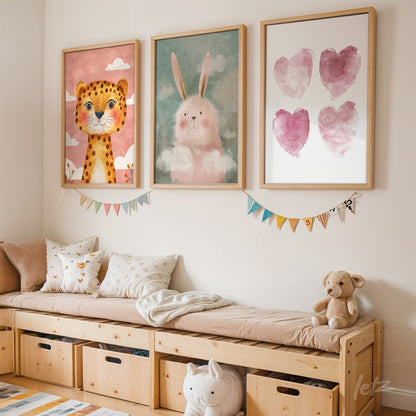collection of children's artwork featuring a smiling lion, a happy bunny, and watercolor hearts on a wall with light wooden frames in a kids' room