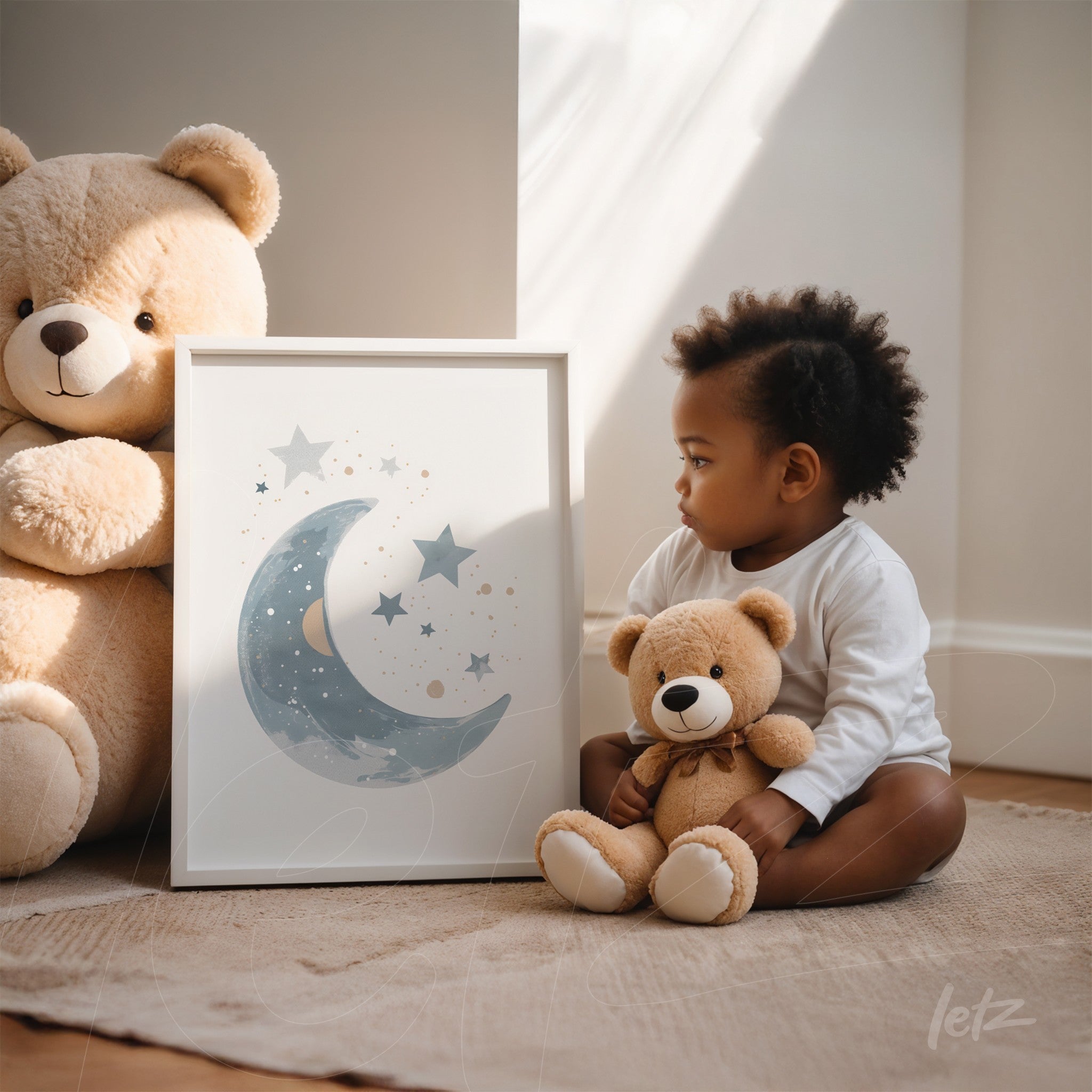 framed art of a moon and stars with white frame displayed next to a young child holding a plush bear in a brightly lit room