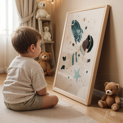 framed artwork of an astronaut floating in a starry background, displayed with a light wooden frame, with a child sitting in front