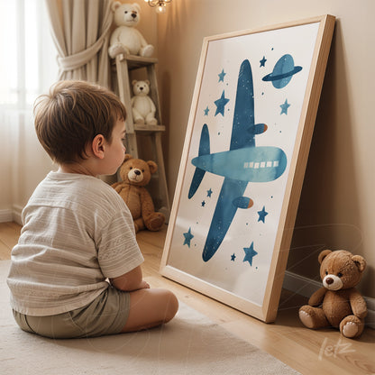 framed wall art featuring a blue airplane among stars and a planet, leaning against a light curtain wall